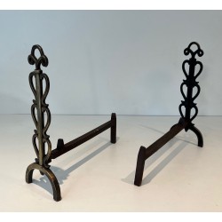Pair of Brass and Iron Andirons with Stacked Scroll-Column Uprights on Arched Bases, in the Style of Raymond Subes