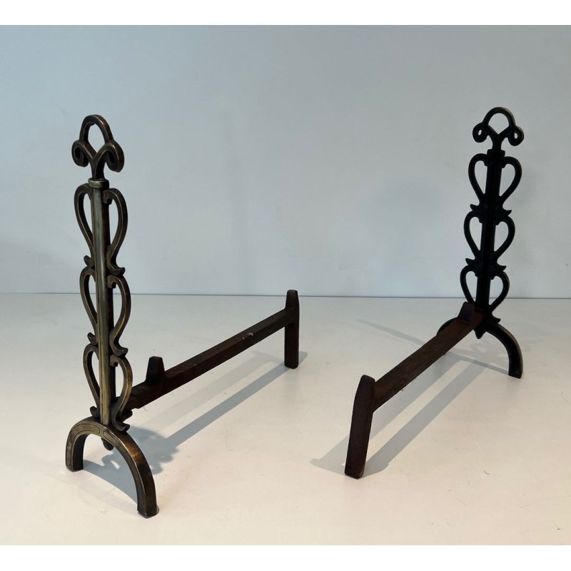 Pair of Brass and Iron Andirons with Stacked Scroll-Column Uprights on Arched Bases, in the Style of Raymond Subes