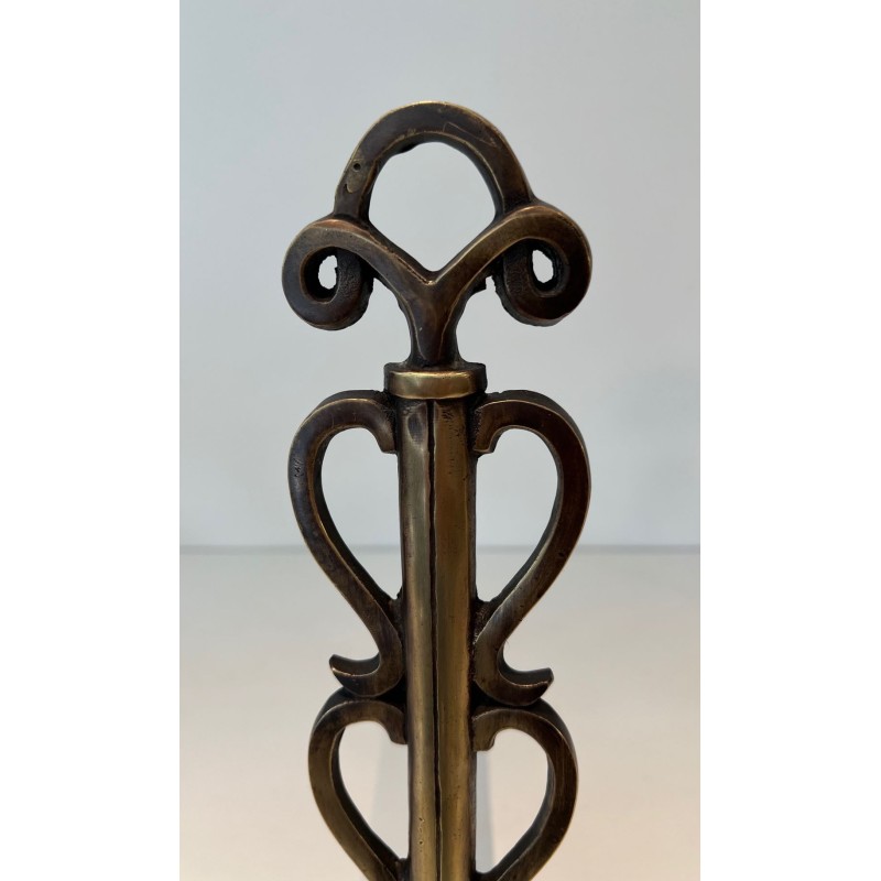 Pair of Brass and Iron Andirons with Stacked Scroll-Column Uprights on Arched Bases, in the Style of Raymond Subes