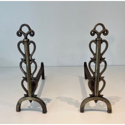 Pair of Brass and Iron Andirons with Stacked Scroll-Column Uprights on Arched Bases, in the Style of Raymond Subes