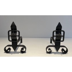 Pair of Wrought Iron Andirons with Obelisk Finials and Belt-and-Buckle Motifs on Scrolled Bases