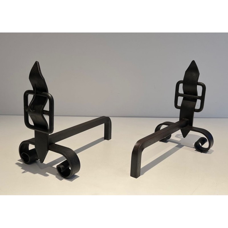 Pair of Wrought Iron Andirons with Obelisk Finials and Belt-and-Buckle Motifs on Scrolled Bases