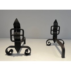 Pair of Wrought Iron Andirons with Obelisk Finials and Belt-and-Buckle Motifs on Scrolled Bases
