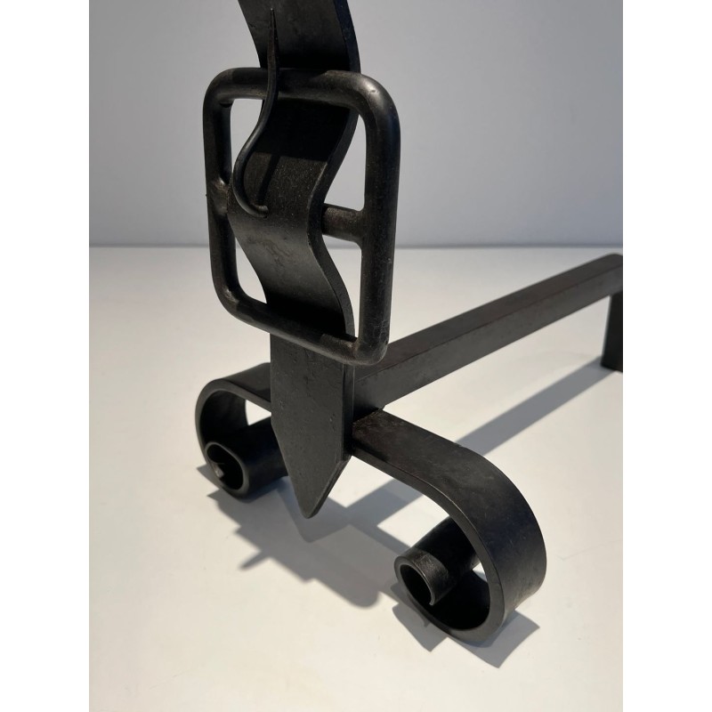 Pair of Wrought Iron Andirons with Obelisk Finials and Belt-and-Buckle Motifs on Scrolled Bases