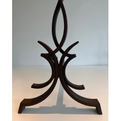 Pair of Wrought Iron Andirons with Stylised Flamboyant Uprights and Scrolled Feet, by Raymond Subes
