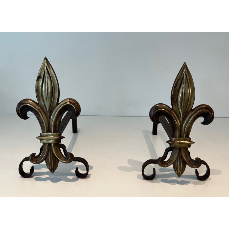 Pair of Bronze and Wrought Iron Andirons with Fleur-de-Lys Uprights. France. Circa 1940.
