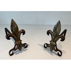 Pair of Bronze and Wrought Iron Andirons with Fleur-de-Lys Uprights. France. Circa 1940.