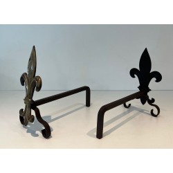 Pair of Bronze and Wrought Iron Andirons with Fleur-de-Lys Uprights. France. Circa 1940.