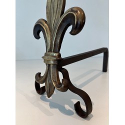 Pair of Bronze and Wrought Iron Andirons with Fleur-de-Lys Uprights. France. Circa 1940.