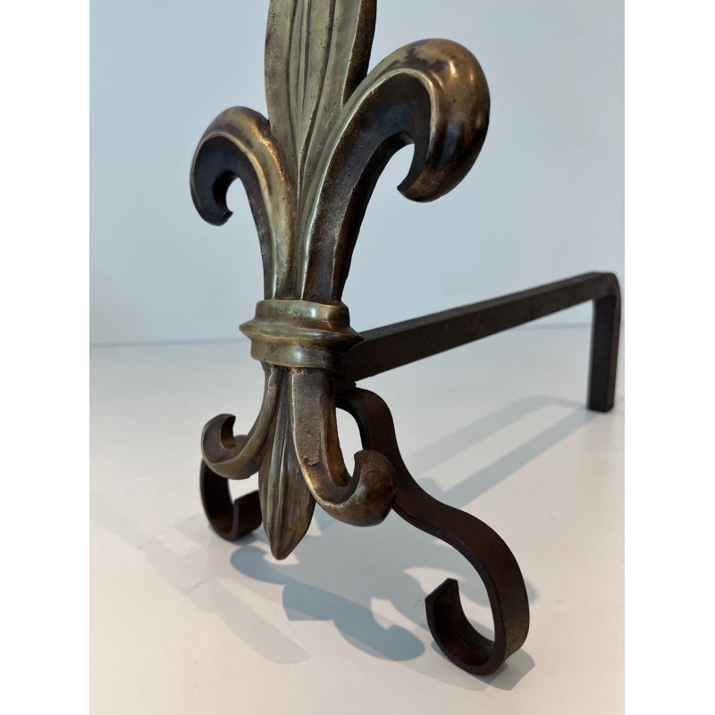 Pair of Bronze and Wrought Iron Andirons with Fleur-de-Lys Uprights. France. Circa 1940.