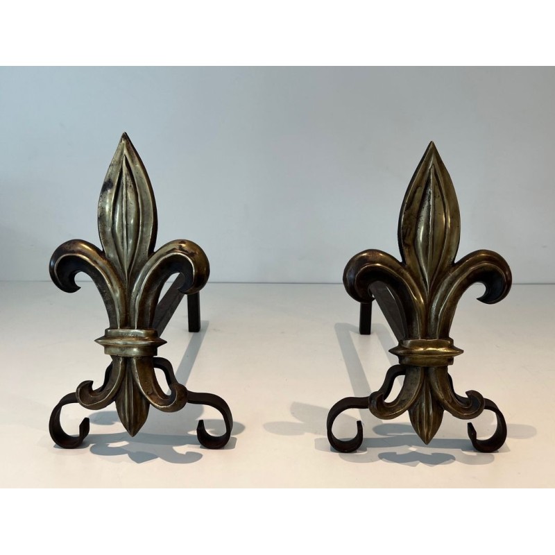Pair of Bronze and Wrought Iron Andirons with Fleur-de-Lys Uprights. France. Circa 1940.