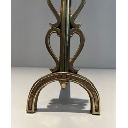 Pair of Brass and Wrought Iron Andirons with Stacked Heart-Lobe Uprights in the Manner of Raymond Subes. France. Circa 1940.