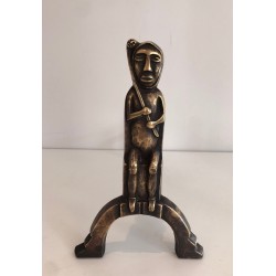 Pair of Bronze Andirons with Seated Shaman Figures, Monogrammed Anton Prinner. France. Circa 1930.