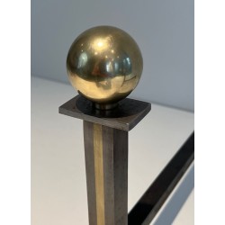 Pair of Modernist Steel and Brass Ball-Finial Andirons in the Manner of Jacques Adnet. France. Circa 1940.