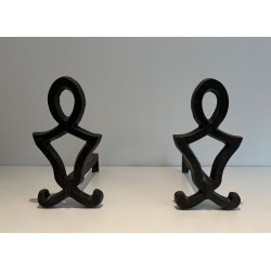 Pair of Wrought Iron Andirons with Oval Loop Finials and Hourglass Uprights by Raymond Subes. France. Circa 1940.