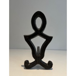 Pair of Wrought Iron Andirons with Oval Loop Finials and Hourglass Uprights by Raymond Subes. France. Circa 1940.
