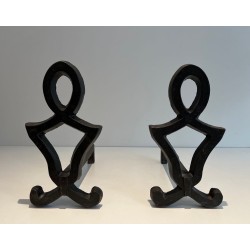 Pair of Wrought Iron Andirons with Oval Loop Finials and Hourglass Uprights by Raymond Subes. France. Circa 1940.