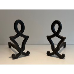 Pair of Wrought Iron Andirons with Oval Loop Finials and Hourglass Uprights by Raymond Subes. France. Circa 1940.