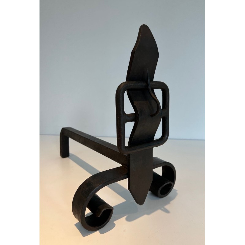 Pair of Wrought Iron Andirons with Flame Finials and Strap-Buckle Midsection. France. Circa 1950.