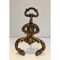 Pair of Neoclassical Bronze and Wrought Iron Andirons with Lion Mascarons. France. Circa 1940.
