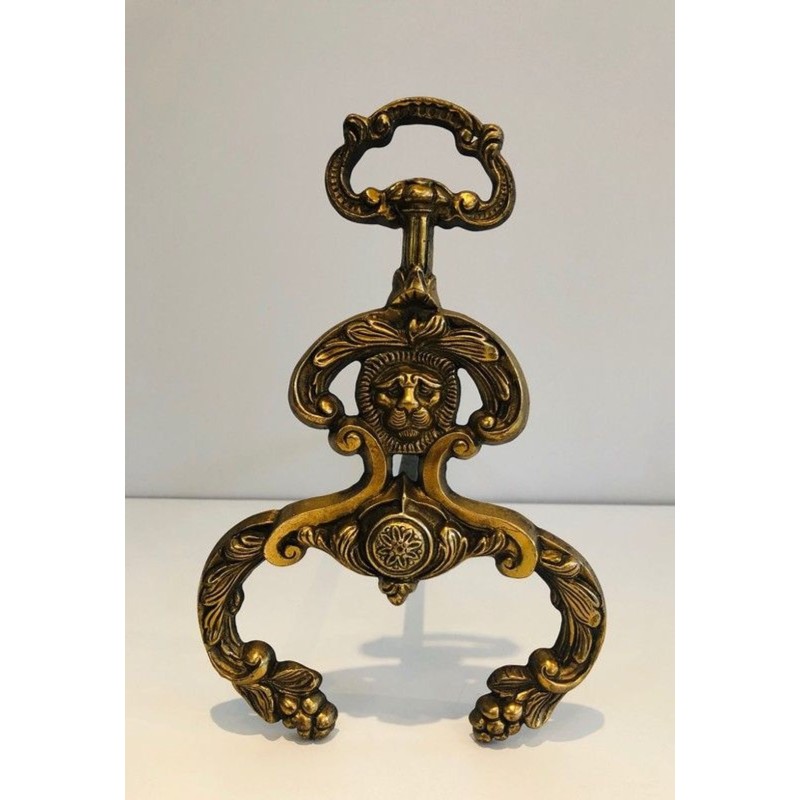 Pair of Neoclassical Bronze and Wrought Iron Andirons with Lion Mascarons. France. Circa 1940.