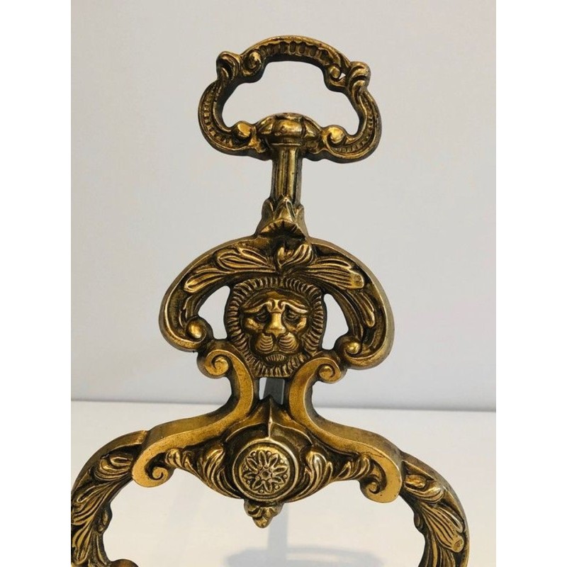 Pair of Neoclassical Bronze and Wrought Iron Andirons with Lion Mascarons. France. Circa 1940.