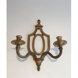 Wall Light in Gilt Wrought Iron with an Oval Escutcheon and Two Arms, in the Style of Gilbert Poillerat, Circa 1940