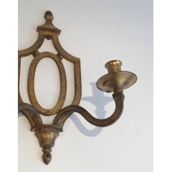 Wall Light in Gilt Wrought Iron with an Oval Escutcheon and Two Arms, in the Style of Gilbert Poillerat, Circa 1940