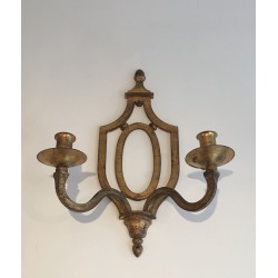 Wall Light in Gilt Wrought Iron with an Oval Escutcheon and Two Arms, in the Style of Gilbert Poillerat, Circa 1940