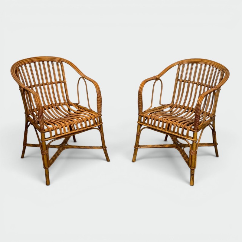 Pair of Rattan Armchairs with Wraparound Back, French Work | Maison Barrois