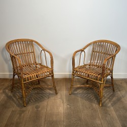 Pair of Rattan Armchairs with Wraparound Back, French Work | Maison Barrois