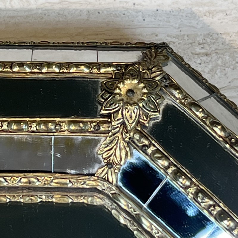 Octagonal Multi-Faceted Wall Mirror with Black Glass and Brass Garlands with Rosettes, Neoclassical, French Work, circa 1970