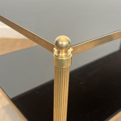 Rectangular Brass Coffee Table with Two Black Lacquered Glass Tiers, Fluted Uprights and Ball Feet, Maison Jansen, Circa 1960
