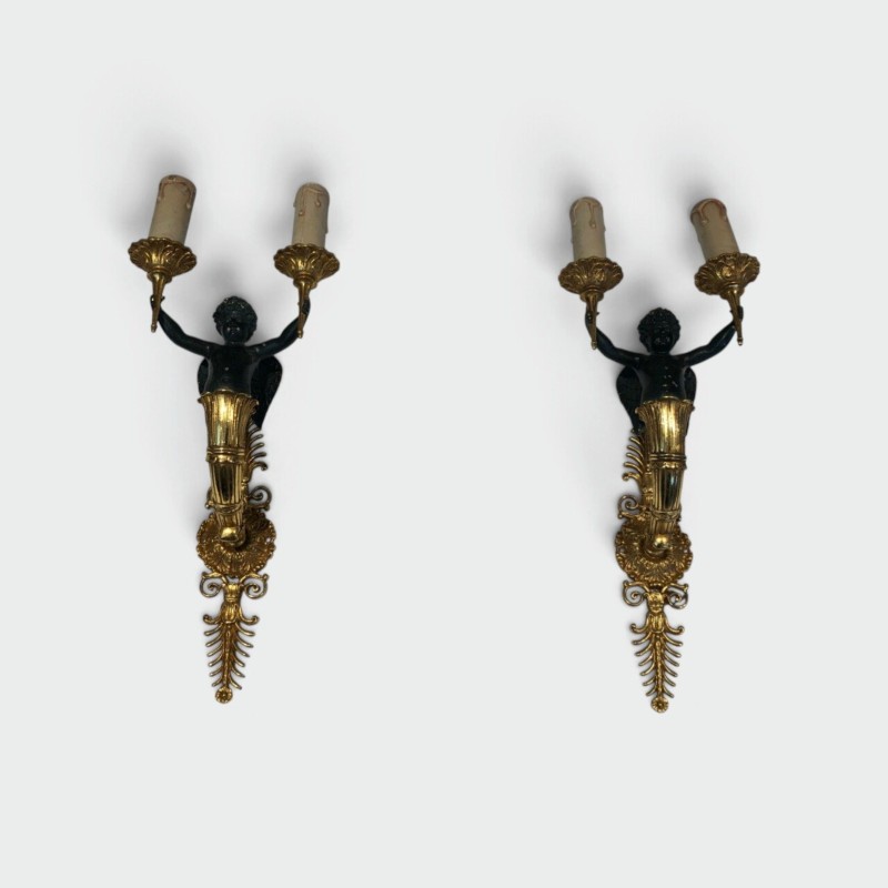 Pair of Empire Style Sconces with Two Light Arms in Gilt and Patinated Bronze Depicting a Winged Cupid, 19th Century