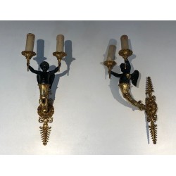 Pair of Empire Style Sconces with Two Light Arms in Gilt and Patinated Bronze Depicting a Winged Cupid, 19th Century