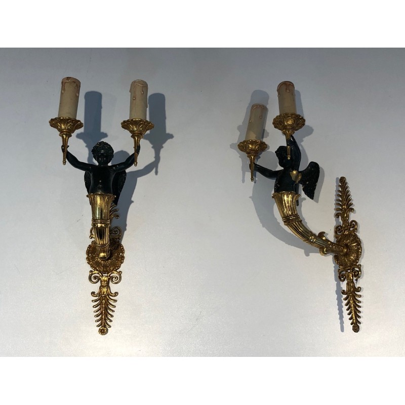 Pair of Empire Style Sconces with Two Light Arms in Gilt and Patinated Bronze Depicting a Winged Cupid, 19th Century