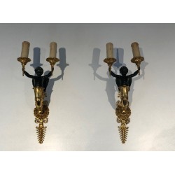 Pair of Empire Style Sconces with Two Light Arms in Gilt and Patinated Bronze Depicting a Winged Cupid, 19th Century
