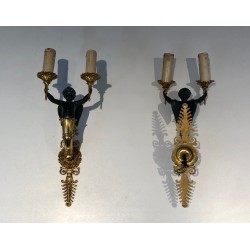 Pair of Empire Style Sconces with Two Light Arms in Gilt and Patinated Bronze Depicting a Winged Cupid, 19th Century