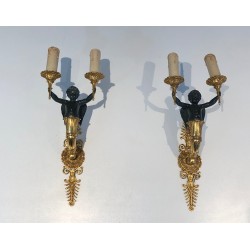 Pair of Empire Style Sconces with Two Light Arms in Gilt and Patinated Bronze Depicting a Winged Cupid, 19th Century