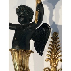 Pair of Empire Style Sconces with Two Light Arms in Gilt and Patinated Bronze Depicting a Winged Cupid, 19th Century