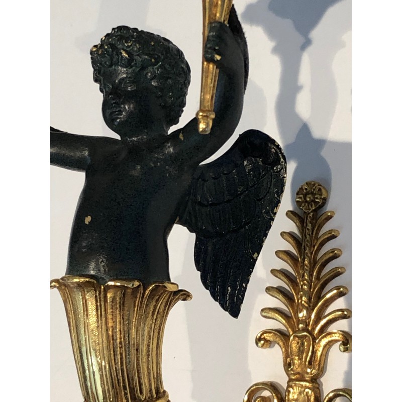 Pair of Empire Style Sconces with Two Light Arms in Gilt and Patinated Bronze Depicting a Winged Cupid, 19th Century