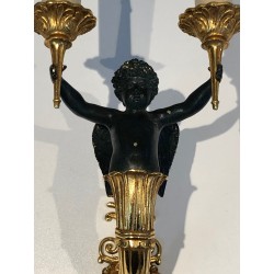 Pair of Empire Style Sconces with Two Light Arms in Gilt and Patinated Bronze Depicting a Winged Cupid, 19th Century