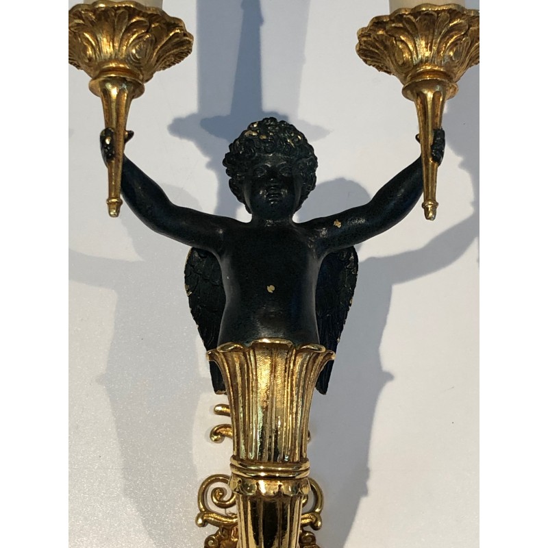 Pair of Empire Style Sconces with Two Light Arms in Gilt and Patinated Bronze Depicting a Winged Cupid, 19th Century