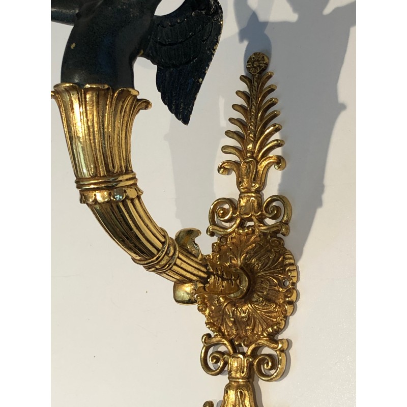 Pair of Empire Style Sconces with Two Light Arms in Gilt and Patinated Bronze Depicting a Winged Cupid, 19th Century