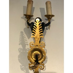 Pair of Empire Style Sconces with Two Light Arms in Gilt and Patinated Bronze Depicting a Winged Cupid, 19th Century