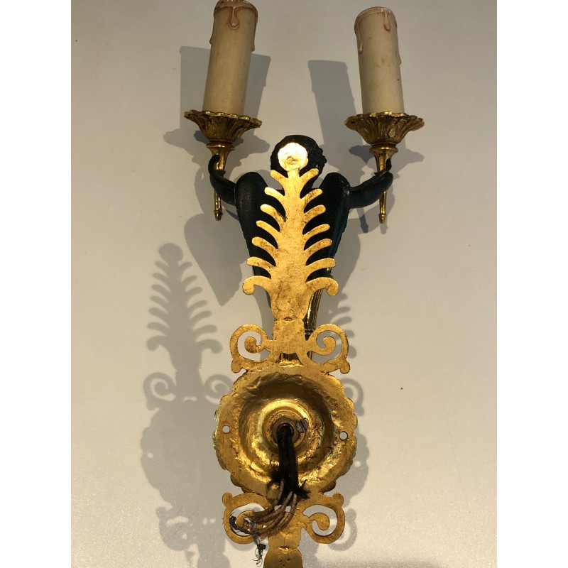 Pair of Empire Style Sconces with Two Light Arms in Gilt and Patinated Bronze Depicting a Winged Cupid, 19th Century
